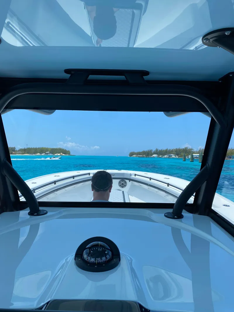 Slide: The Image of View from 2022 Yellowfin 39 boat cruising on clear blue waters. - 14