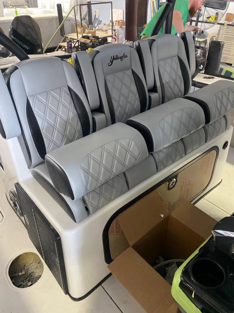 Slide: The Image of 2022 Yellowfin 39 boat with luxurious diamond-stitched seating. - 16