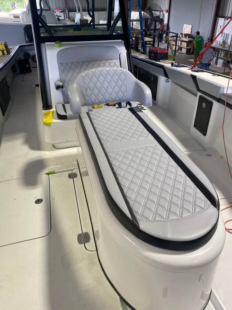 Slide: The Image of 2022 Yellowfin 39 boat interior with diamond-stitched seating and modern design. - 19