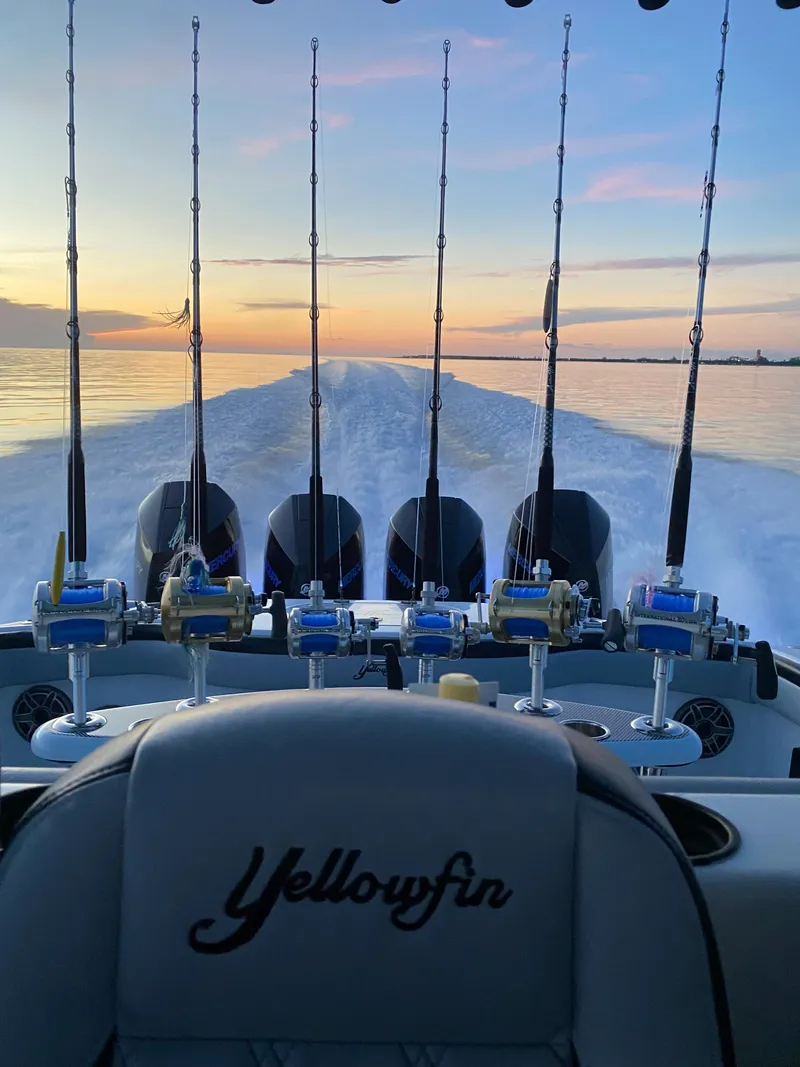 Slide: The Image of 2022 Yellowfin 39 boat with fishing rods at sunset. - 20