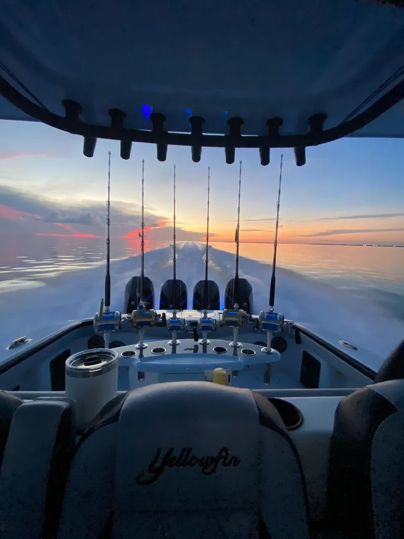 Slide: The Image of 2022 Yellowfin 39 boat at sunset with fishing rods. - 21