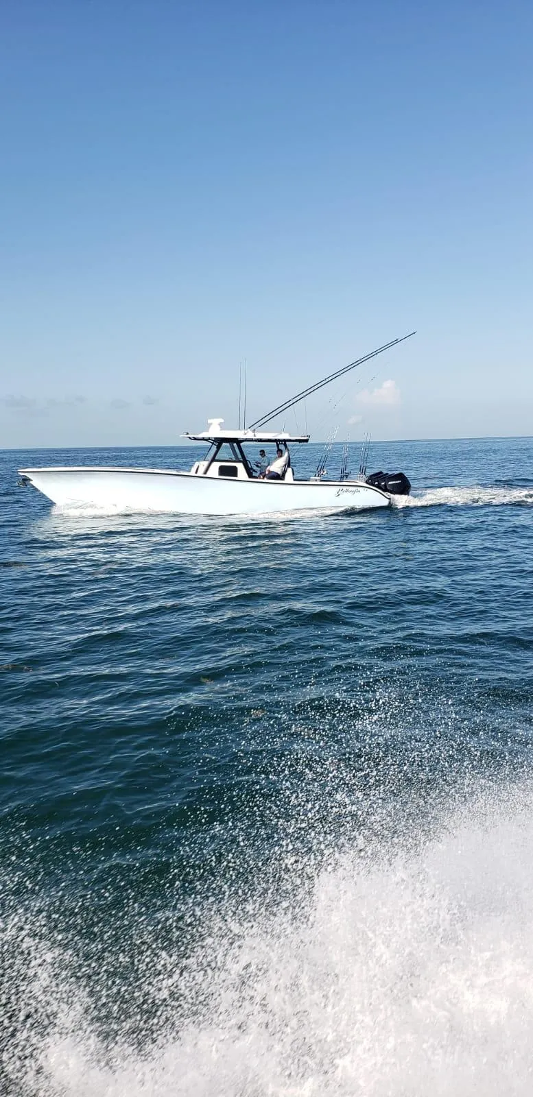Slide: The Image of 2022 Yellowfin 39 boat cruising on open water. - 3