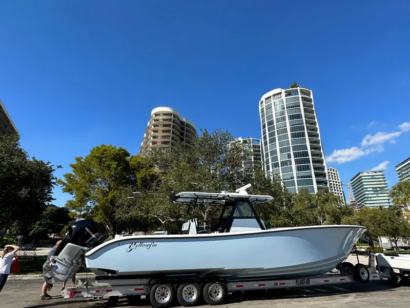 Slide: The Image of 2022 Yellowfin 39 boat on trailer with cityscape background. - 4
