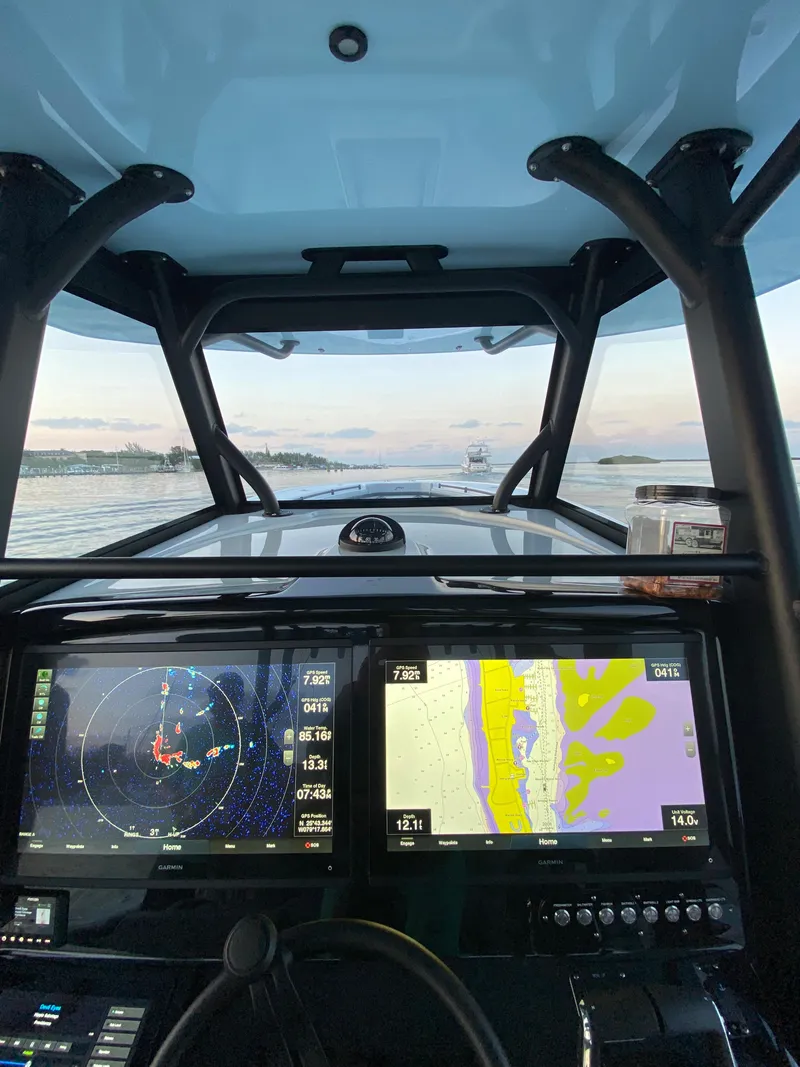 Slide: The Image of Cockpit view of a 2022 Yellowfin 39 boat with navigation screens. - 6