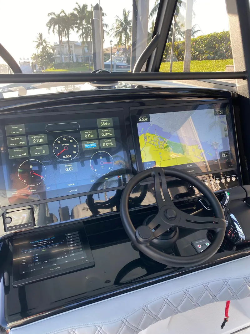 Slide: The Image of 2022 Yellowfin 39 boat dashboard with navigation and control screens. - 7