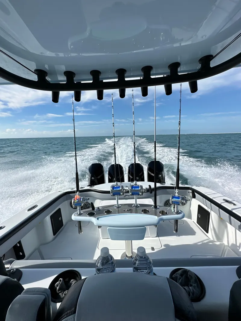 Slide: The Image of 2022 Yellowfin 39 boat cruising on open water with fishing rods. - 9