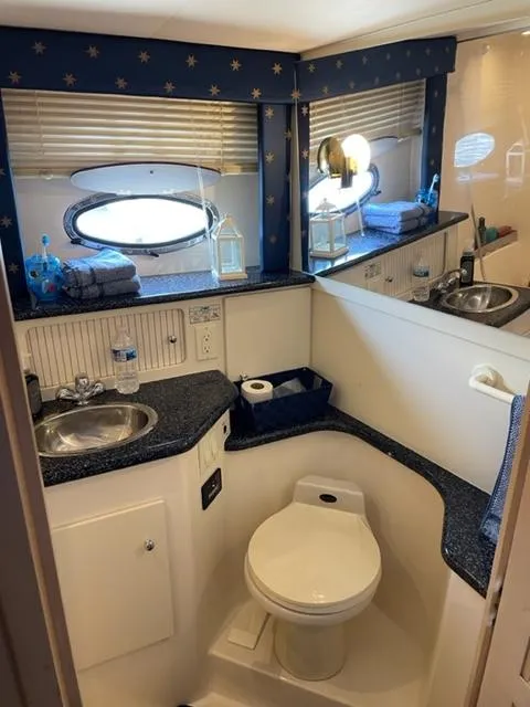 Slide: The Image of 1999 Carver 356 Aft Cabin Yacht bathroom with sink and toilet. - 49