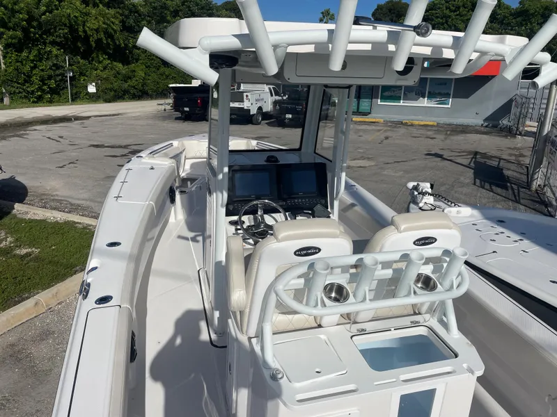 Slide: The Image of 2024 Blue Wave 2800 Makaira boat with dual consoles and advanced navigation system. - 4