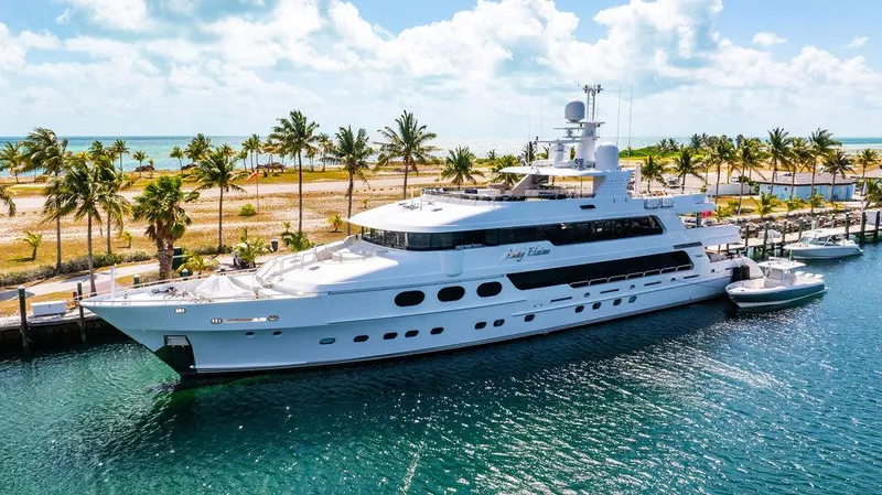 Slide: The Image of Luxurious 2008 Christensen Tri-Deck Motor Yacht docked by palm-lined shore. - 1