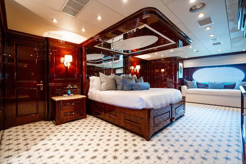 Slide: The Image of Luxurious bedroom interior of 2008 Christensen Tri-Deck Motor Yacht with elegant wood finishes. - 11