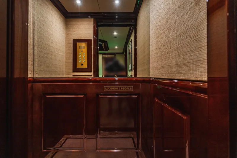 Slide: The Image of Luxurious interior of 2008 Christensen Tri-Deck Motor Yacht with elegant wood paneling. - 18