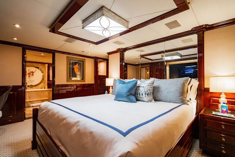 Slide: The Image of Luxurious bedroom interior on 2008 Christensen Tri-Deck Motor Yacht with elegant decor and plush bedding. - 25