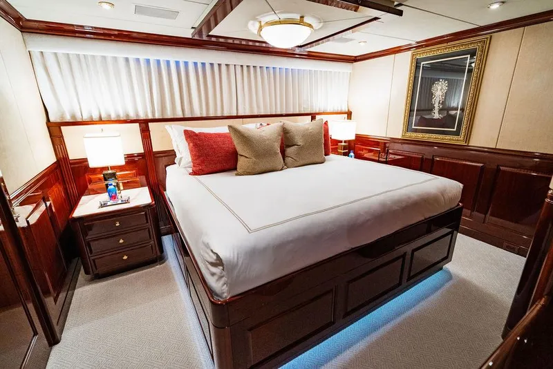 Slide: The Image of Luxurious bedroom on 2008 Christensen Tri-Deck Motor Yacht with elegant wood paneling and plush bedding. - 30