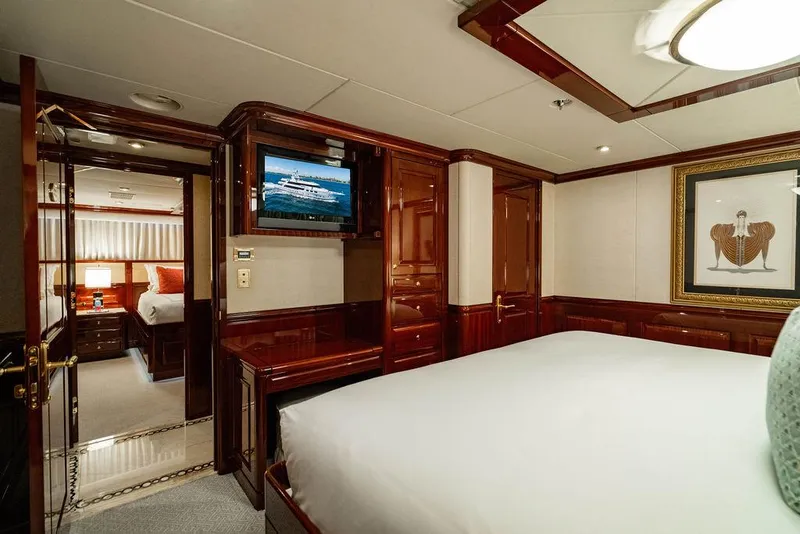 Slide: The Image of Luxurious bedroom interior on 2008 Christensen Tri-Deck Motor Yacht with elegant wood finishes. - 31