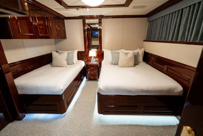 Slide: The Image of Luxurious twin bedroom on 2008 Christensen Tri-Deck Motor Yacht with elegant wood finishes. - 33