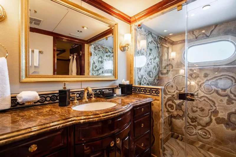 Slide: The Image of Luxurious bathroom on 2008 Christensen Tri-Deck Motor Yacht with marble countertop and ornate shower design. - 34