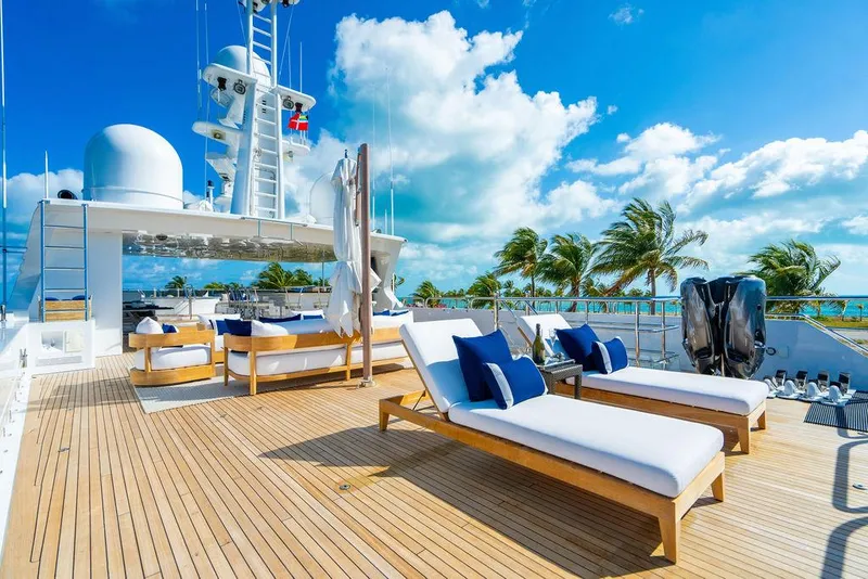Slide: The Image of Luxurious 2008 Christensen Tri-Deck Motor Yacht with sun loungers on deck, under a clear blue sky. - 41