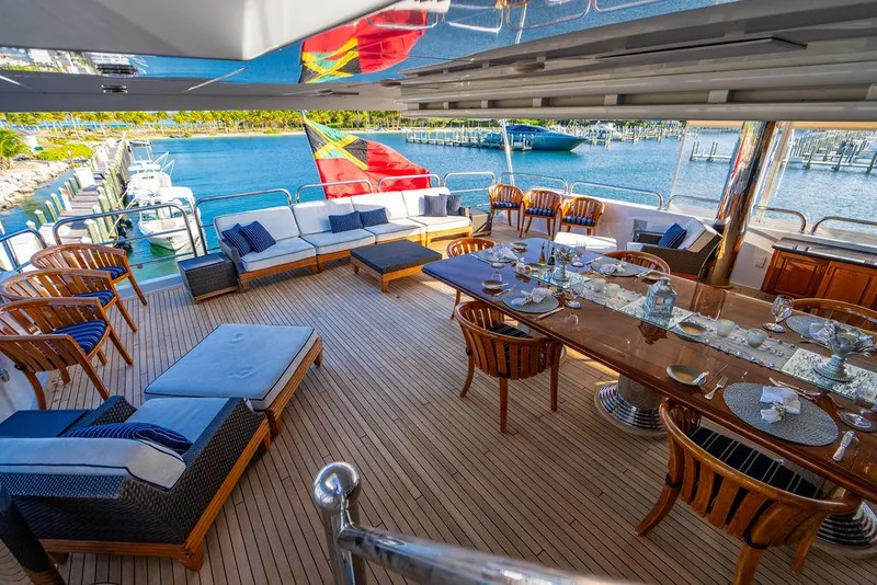 Slide: The Image of Luxurious 2008 Christensen Tri-Deck Motor Yacht with elegant outdoor dining and seating area. - 42