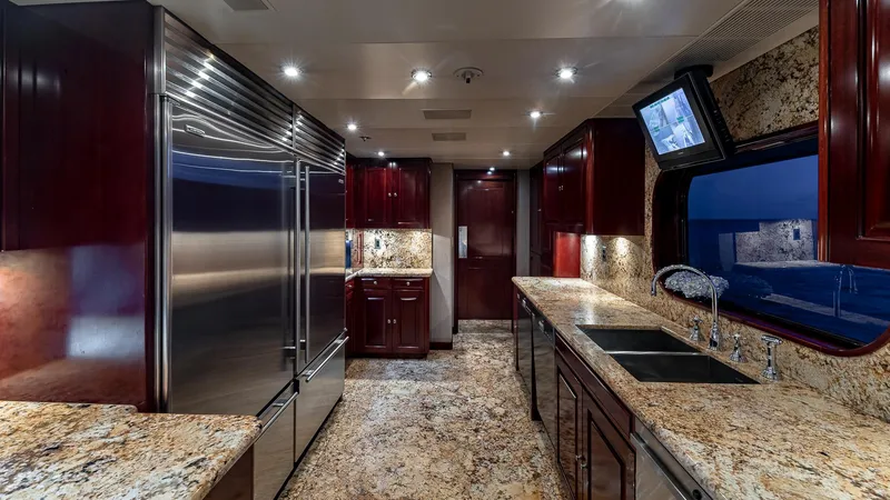 Slide: The Image of Luxurious kitchen interior of 2008 Christensen Tri-Deck Motor Yacht with granite countertops and stainless steel appliances. - 8