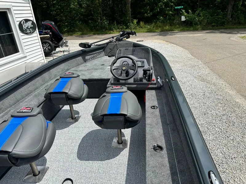 Slide: The Image of 2024 Ranger VS1665SC fishing boat interior with steering console and seating. - 5