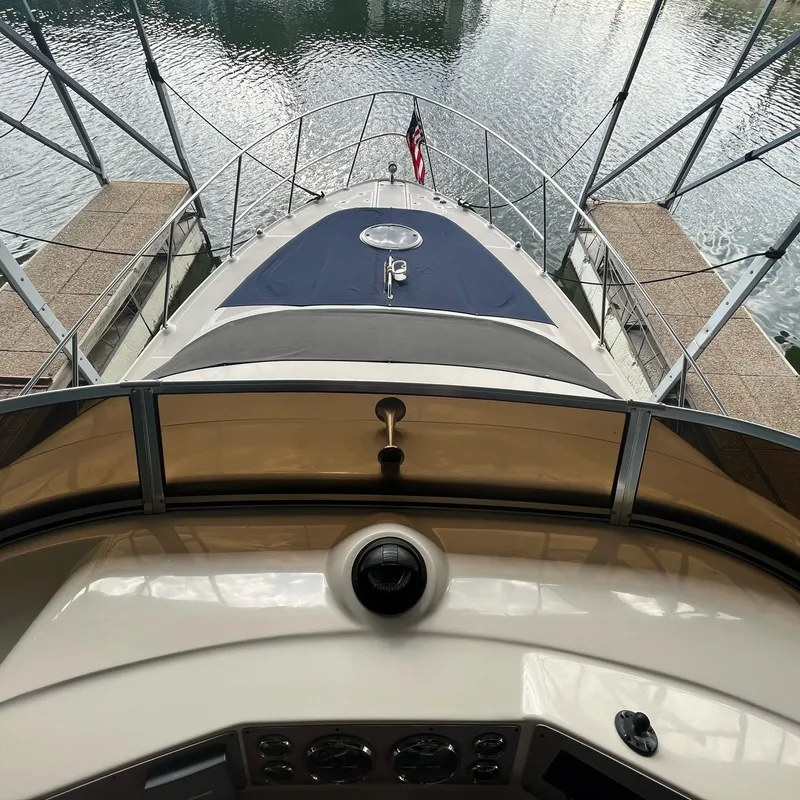 Slide: The Image of 2002 Regal Commodore 3880 yacht docked, view from the helm. - 10