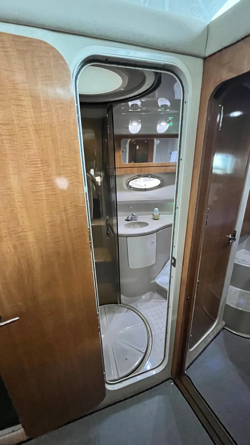 Slide: The Image of 2002 Regal Commodore 3880 yacht interior bathroom with wooden door and modern fixtures. - 23