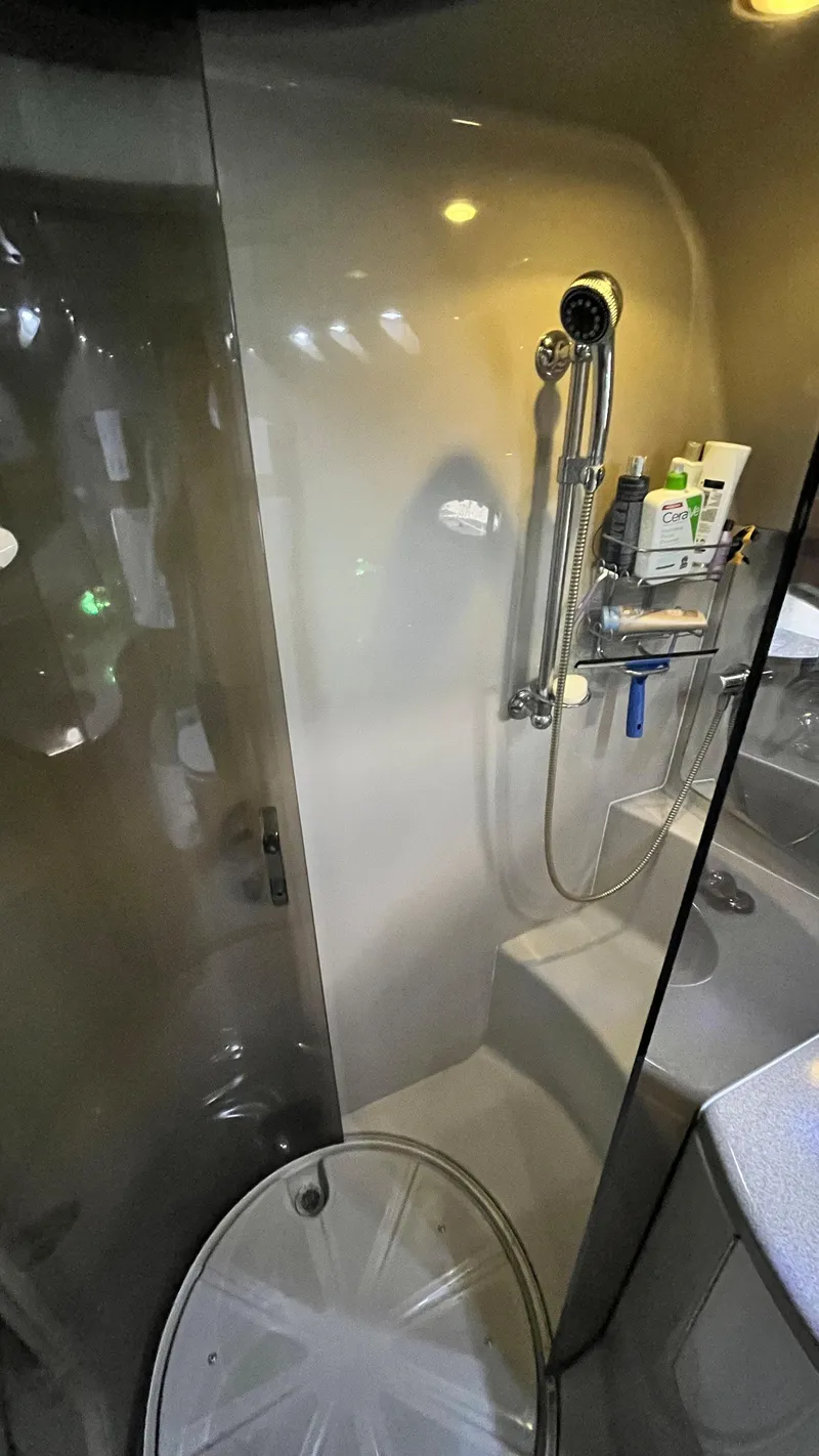 Slide: The Image of 2002 Regal Commodore 3880 yacht bathroom with modern shower and amenities. - 25