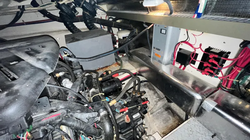 Slide: The Image of Engine room of a 2002 Regal Commodore 3880 boat with visible wiring and components. - 37