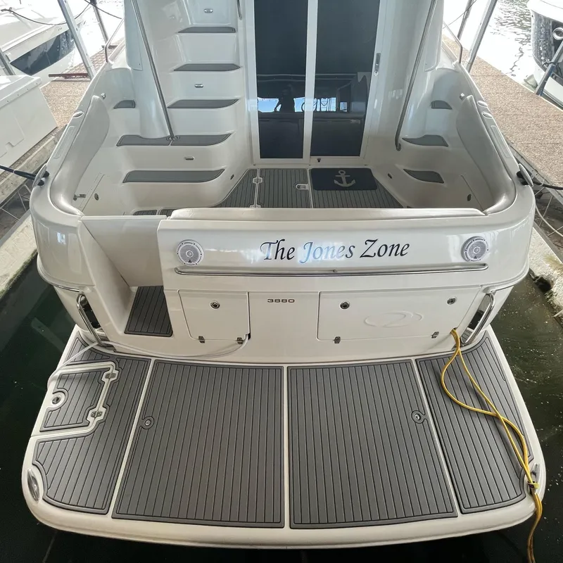 Slide: The Image of 2002 Regal Commodore 3880 yacht stern with The Jones Zone name. - 5