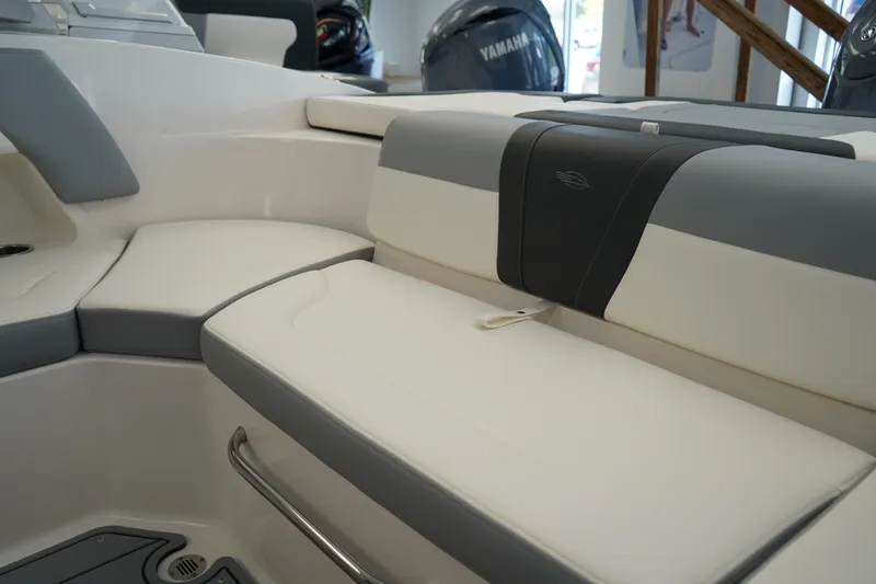 Slide: The Image of 2024 Chaparral 23 SSi OB boat interior with cushioned seating and sleek design. - 14