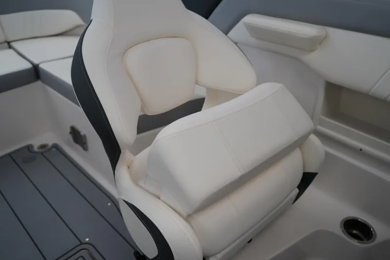 Slide: The Image of 2024 Chaparral 23 SSi OB boat interior with white cushioned seating. - 17