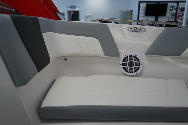 Slide: The Image of 2024 Chaparral 23 SSi OB boat interior with cushioned seating and speaker. - 33