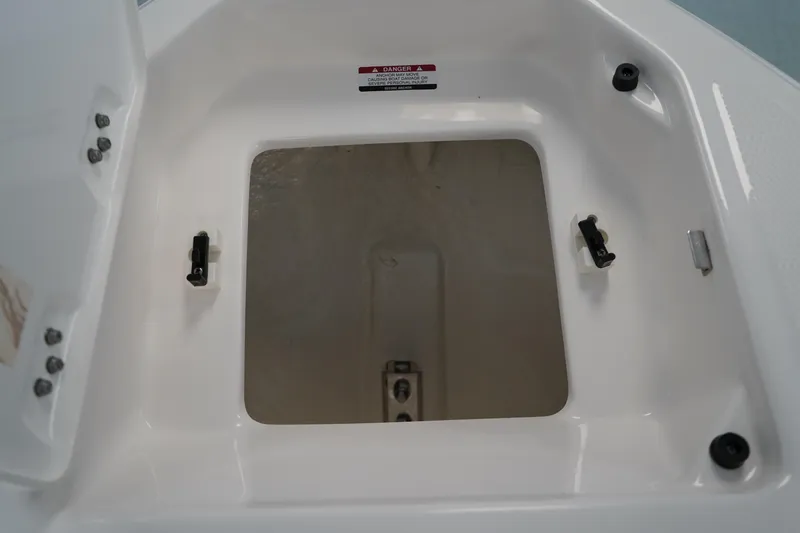 Slide: The Image of 2024 Chaparral 23 SSi OB boat storage compartment, open and empty. - 39