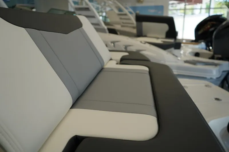 Slide: The Image of 2024 Chaparral 23 SSi OB boat interior with sleek, modern seating design. - 9