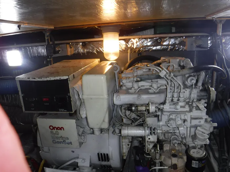 Slide: The Image of Engine room of a 1988 Trojan 12 Meter boat with Onan generator. - 10