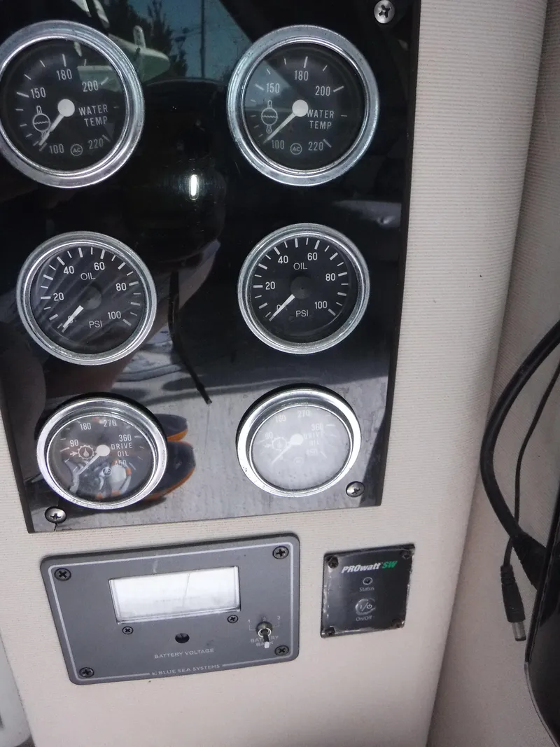 Slide: The Image of Dashboard of a 1988 Trojan 12 Meter boat with gauges and controls. - 14