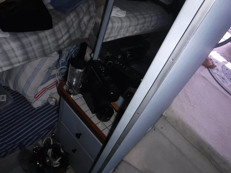 Slide: The Image of Interior of a 1988 Trojan 12 Meter boat with bedding and storage. - 20