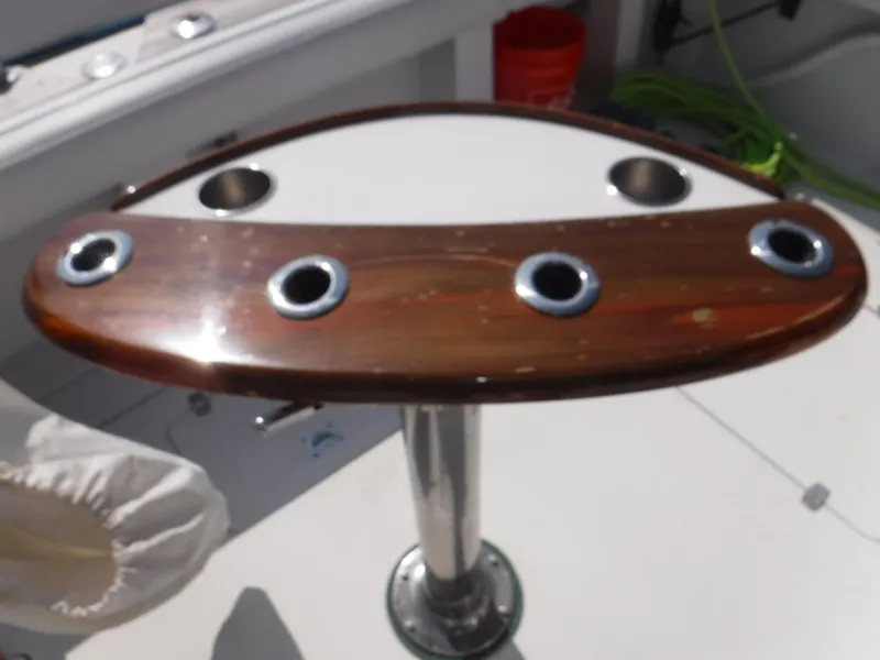 Slide: The Image of Wooden fishing rod holder on a 1988 Trojan 12 Meter boat deck. - 24