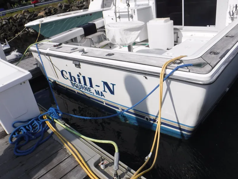 Slide: The Image of 1988 Trojan 12 Meter boat named "Chill-N" docked in Bourne, MA. - 25