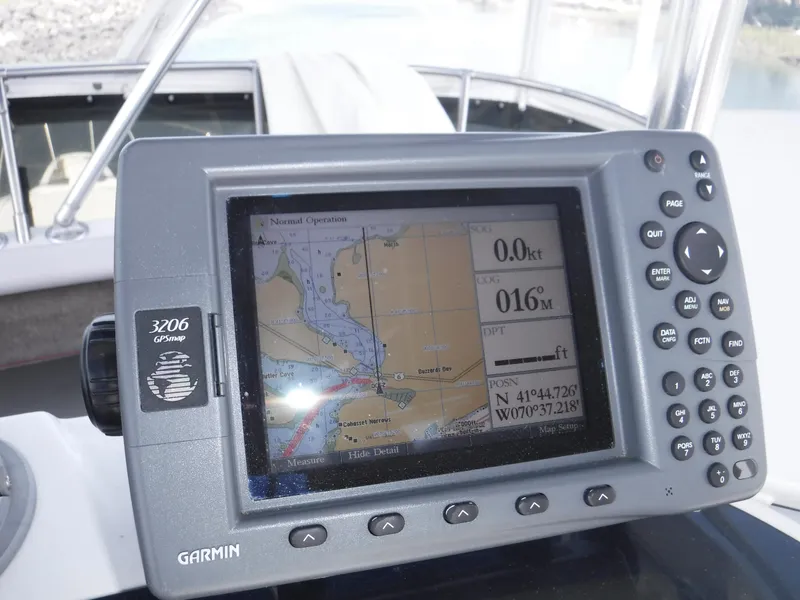 Slide: The Image of Garmin GPS device on 1988 Trojan 12 Meter boat displaying navigation map. - 34