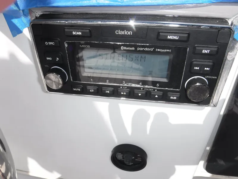 Slide: The Image of Clarion stereo system on a 1988 Trojan 12 Meter boat dashboard. - 36