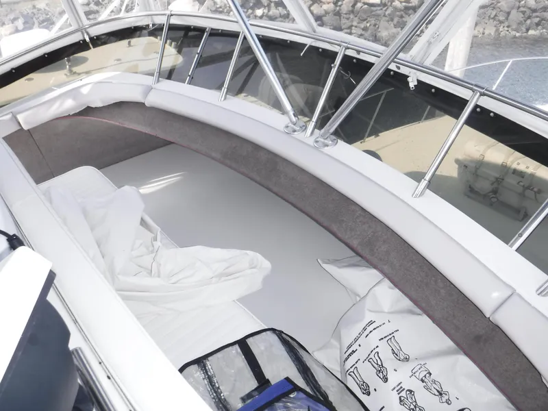 Slide: The Image of 1988 Trojan 12 Meter boat interior with seating and storage area. - 38