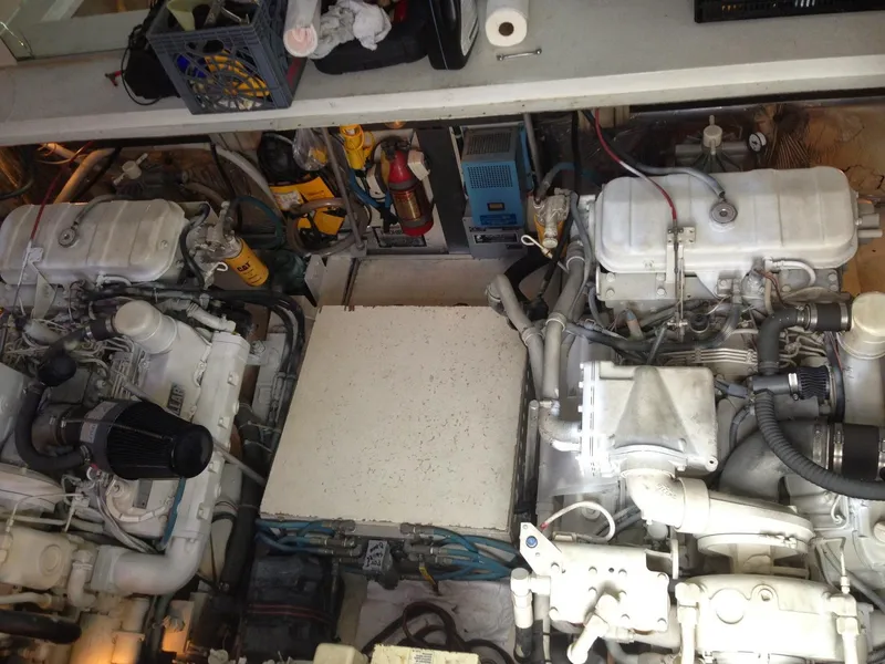 Slide: The Image of Engine room of a 1988 Trojan 12 Meter boat, featuring dual engines and equipment. - 5