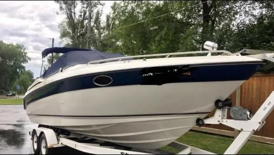 Slide: The Image of 1997 Regal Ventura 8.3 SC boat on trailer, parked outdoors. - 10