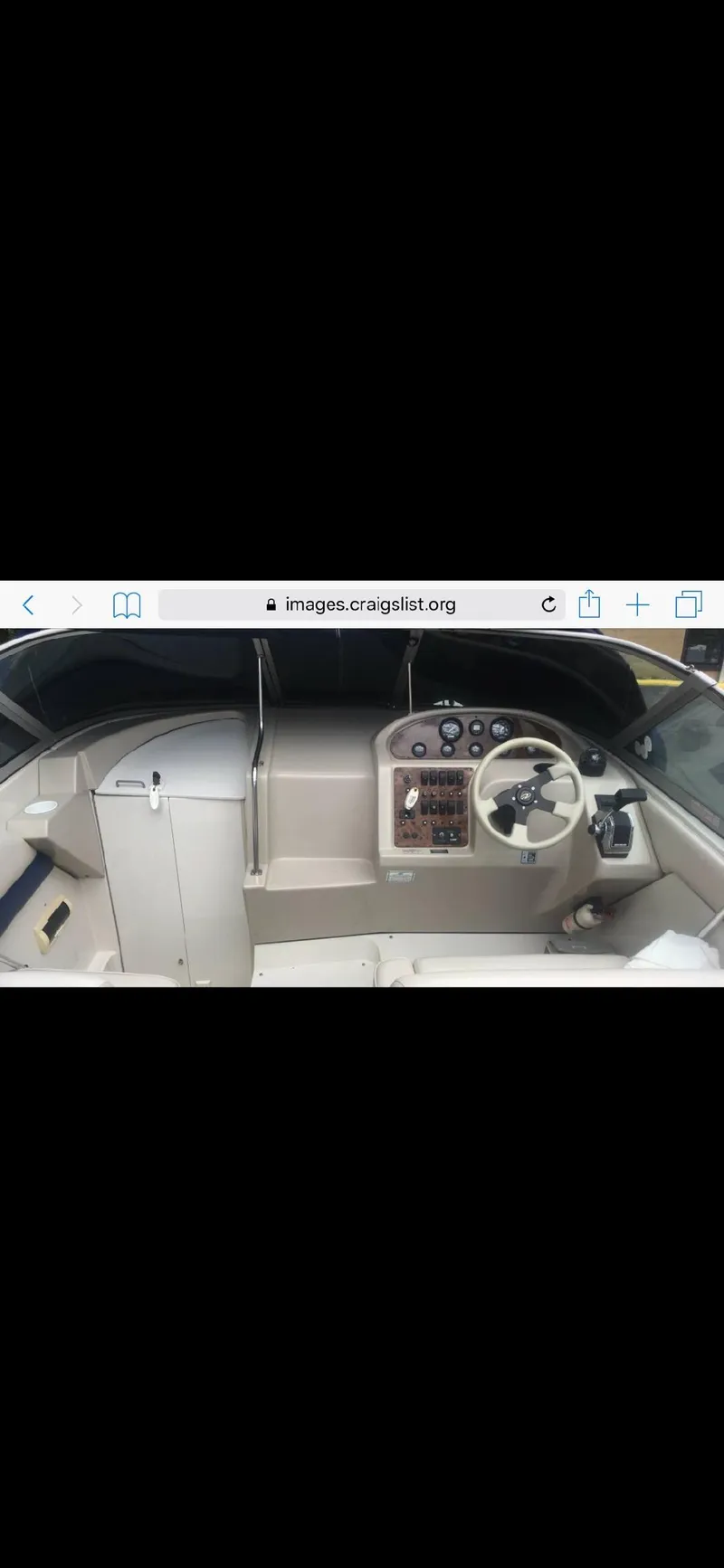 Slide: The Image of 1997 Regal Ventura 8.3 SC boat cockpit with steering wheel and control panel. - 8