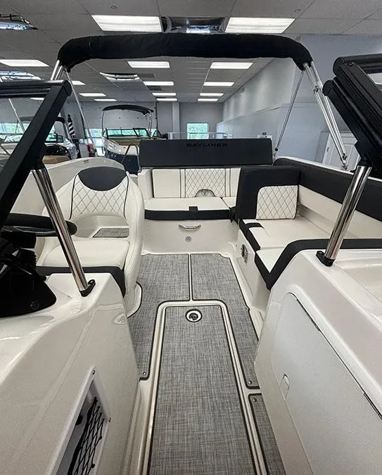 Slide: The Image of 2024 Bayliner DX 2050 boat interior with modern seating and sleek design. - 12