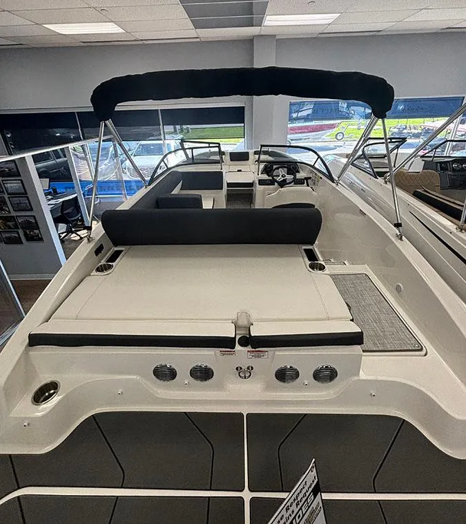 Slide: The Image of 2024 Bayliner DX 2050 boat interior with seating and canopy. - 3