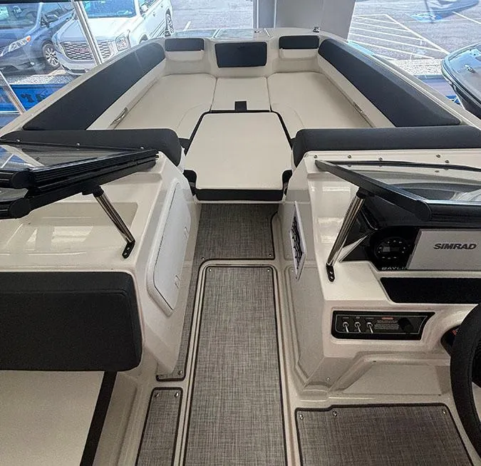 Slide: The Image of 2024 Bayliner DX 2050 boat interior with seating and control panel. - 4