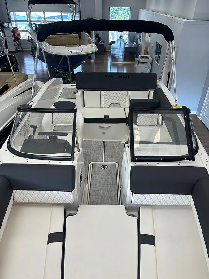 Slide: The Image of 2024 Bayliner DX 2050 boat interior with seating and windshield. - 5