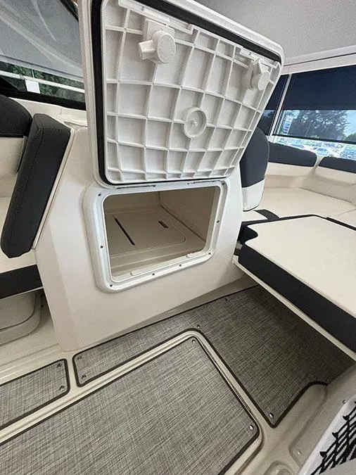 Slide: The Image of 2024 Bayliner DX 2050 boat interior storage compartment. - 9